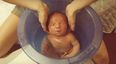 Newborn Baby Enjoys First Bath in the Tummy Tub