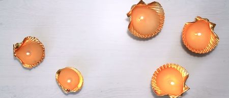 CHEAP & CHIC: These crafty seashell candles make a glam gift