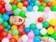 Another way your child can use those ‘ball pit’ balls that are all over the house