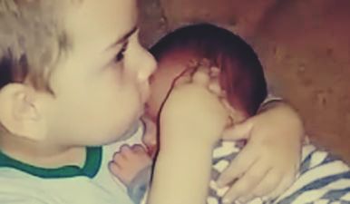 Watch: Toddler Refusing To Let Go Of His Baby Brother