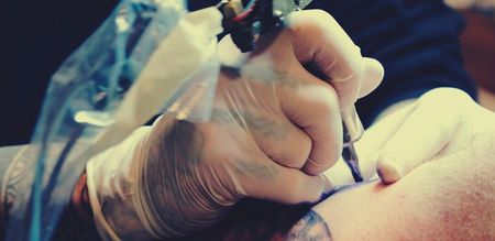 Parents arrested over 12-year-old daughter’s ‘Jesus Loves’ tattoo