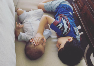 The tender moment mum catches son comforting his baby brother who has terminal cancer