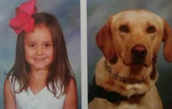 This little girl has an alert dog – and she insisted he feature in her yearbook