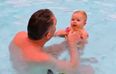 This swimming instructor is teaching four-month-olds to stand