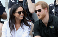 Their first kiss! Prince Harry and Meghan Markle get cosy at Invictus