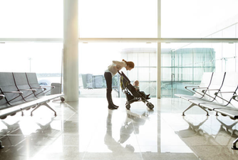 Woman mom-shamed after lying her baby on airport floor speaks out