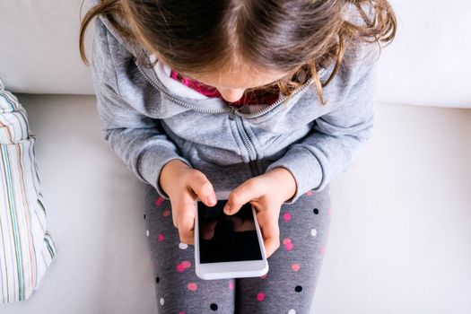 The one thing you should do before giving your child their own phone