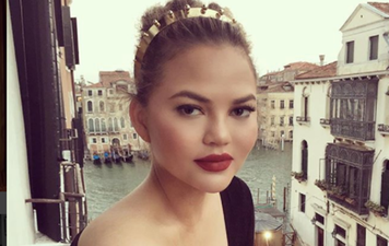 Chrissy Teigen reveals her baby bump and she looks amazing