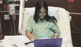 Woman calmly finishes her college exams while in labour