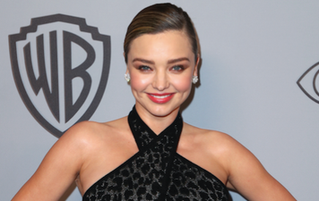 Miranda Kerr debuts her blossoming baby bump at the Golden Globes