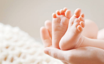 Baby born with 31 fingers and toes will have extra digits removed