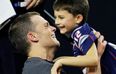 American footballer faces criticism for kissing 11-year-old son on the lips