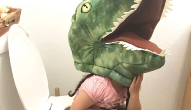 Toddler refuses to take her giant fluffy toy dinosaur head off… even while peeing