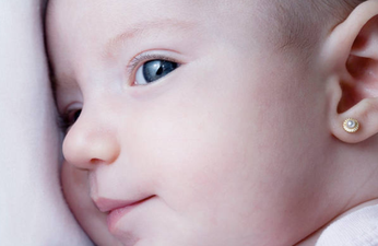 Dad’s warning after piercing gun gets stuck on baby’s ear causing ‘damage’