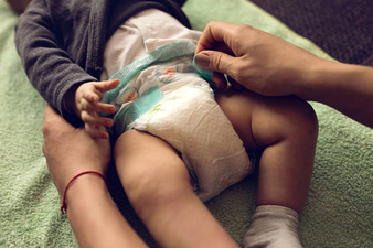The handy trick that makes all the difference when it comes to changing your little boy’s nappy