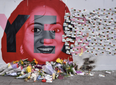 People are leaving flowers, tributes and messages at the mural of Savita in Dublin