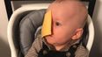 Parents are throwing cheese slices at their babies’ heads and it’s proving controversial