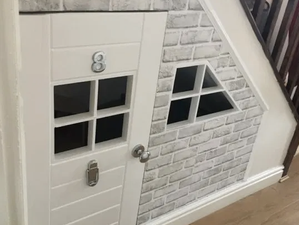 Creative grandad DIYs amazing under-the-stairs playhouse for his grandsons for less than €60