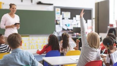 Simon Harris has said that schools could open for one day a week during summer