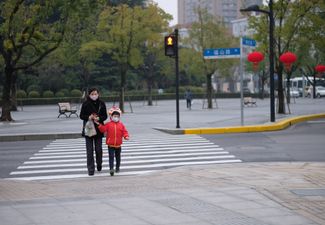 Children in China begin to head back to school as lockdown restrictions ease