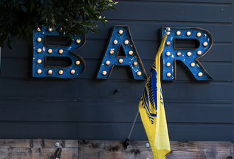 Two crafty families create a ‘social distance’ bar between their two gardens – and it is the best