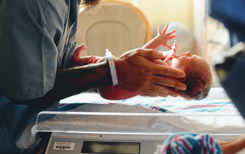 Dad-to-be slammed online for sharing snap of himself eating pizza in the delivery room