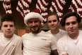 Victoria Beckham is every mum trying to get the kids to pose for a Christmas card photo