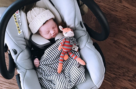 carrying baby car seats the wrong way