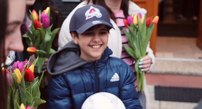 Boy who fled Ukraine alone with just a phone number written on hand reunited with mother