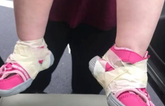 Creche called out after taping shoes to infant’s feet