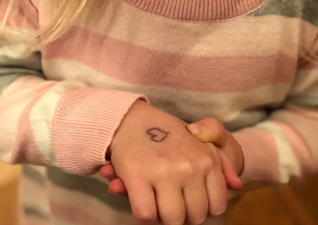 Mum reveals the heartbreaking reason she draws a heart on her daughter’s hand every day