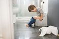 Parent seeks advice on teaching her son how to sit while peeing