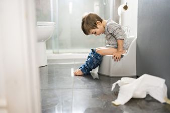 Parent seeks advice on teaching her son how to sit while peeing